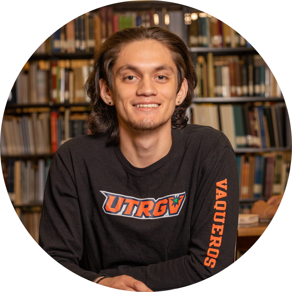 smiling student with bookshelf.  off campus employer